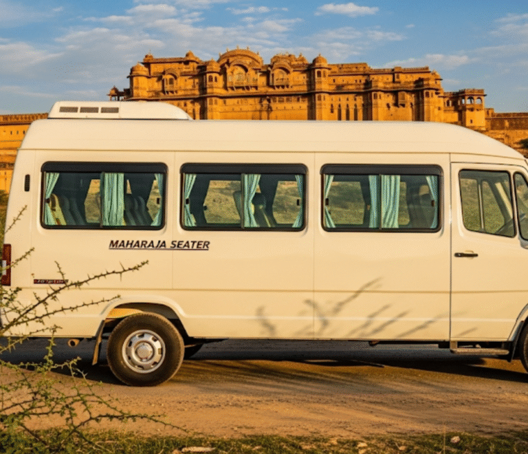 A white color maharaja seater tempo traveller standing in front of a fort in rajasthan
